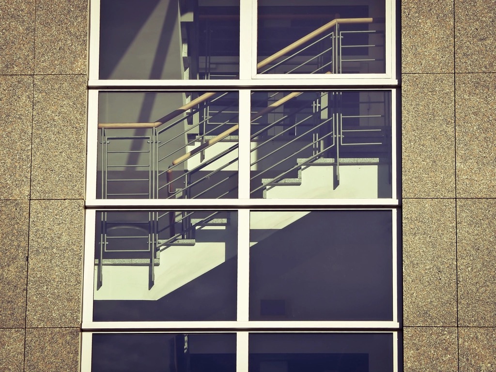 Close-up of a clean building facade and glass stairwell
